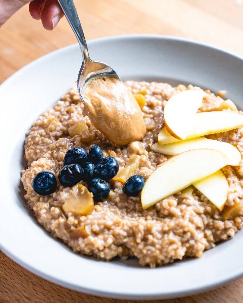 Apple Cinnamon Pressure Cooker Steel Cut Oats |  A couple is cooking