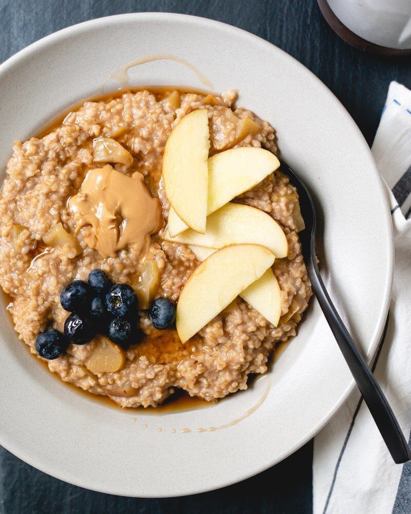 Apple Cinnamon Pressure Cooker Steel Cut Oats |  A couple is cooking