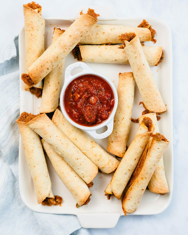 Baked flautas (taquitos) filled with beans
