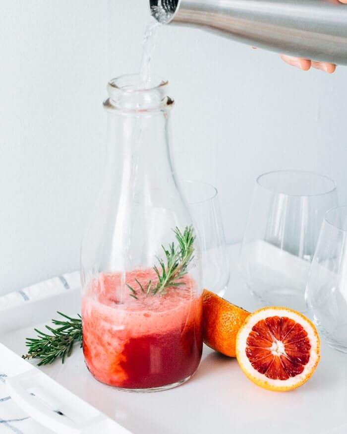 Blood Orange Rosemary Sparkling Water {Brunch Menu} |  A couple is cooking