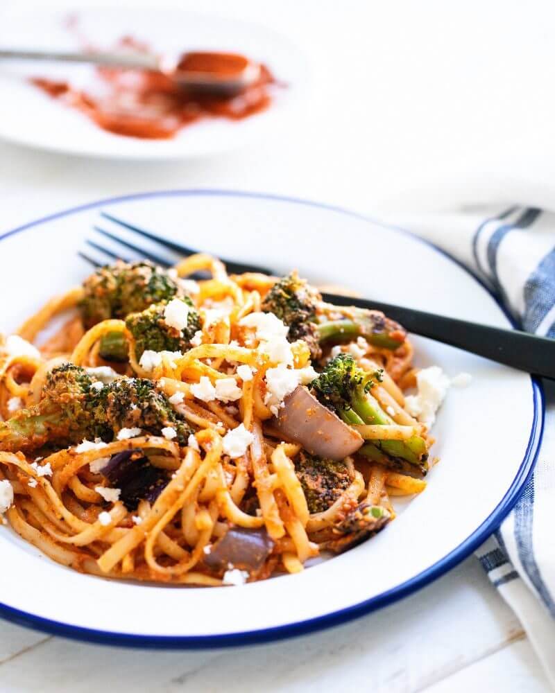Grilled vegetable pasta with Romesco |  A couple is cooking