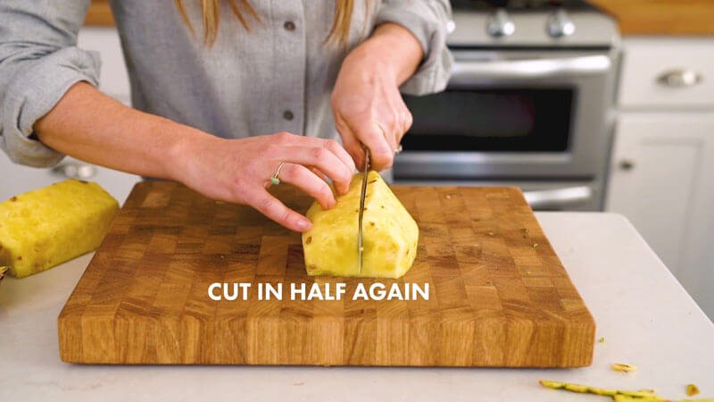 How to cut a pineapple |  Halve again