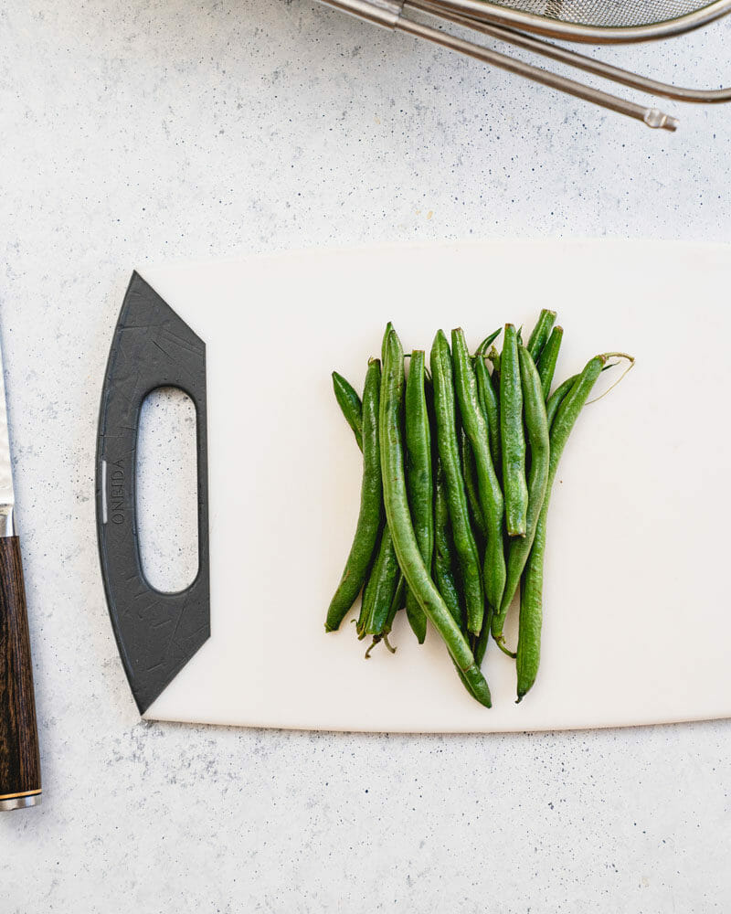 How to Cut Green Beans: Take a handful and place them in a pile