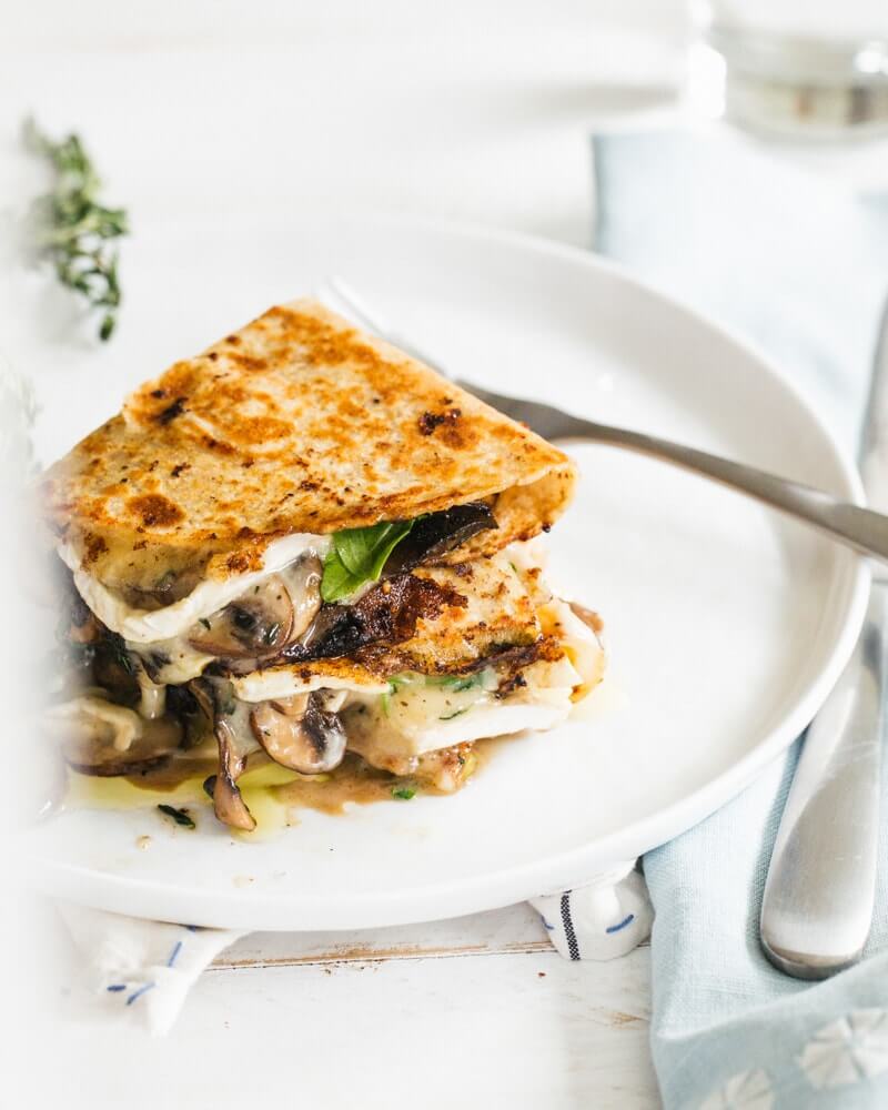 Mushroom and Brie Quesadillas |  A couple is cooking