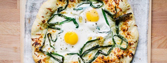White Egg Pizza with Pecorino and Spring Onions |  A couple is cooking