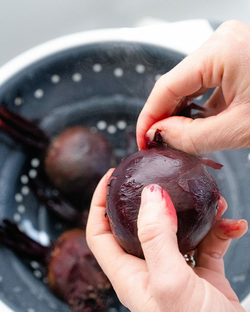Remove the skin from the cooked beets