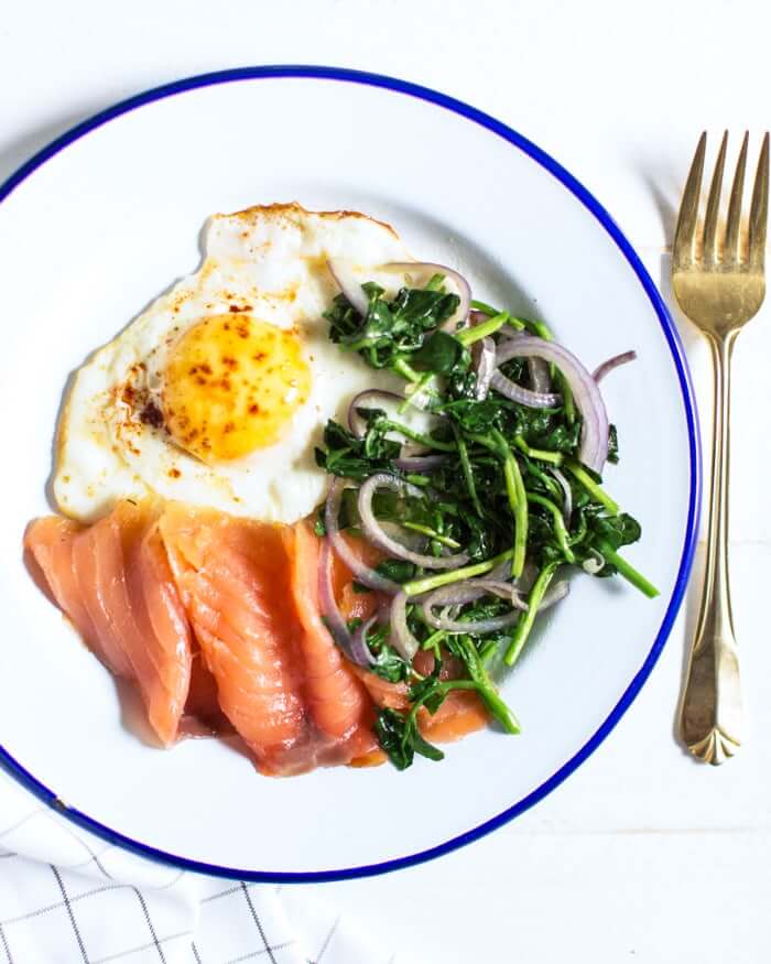 Truffled Egg with Smoked Salmon |  A couple is cooking