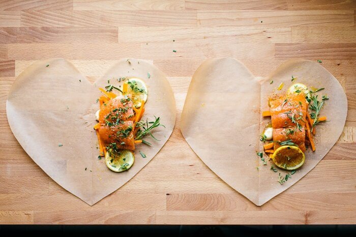 Salmon en papillote with fried potatoes |  A couple is cooking