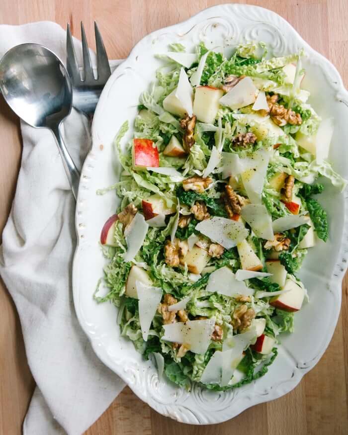 Apple-walnut-savoy cabbage salad |  A couple is cooking