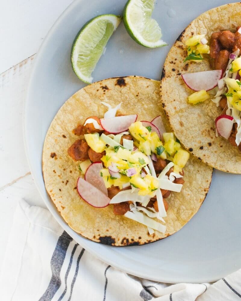 BBQ Bean Tacos with Pineapple Salsa |  A couple is cooking