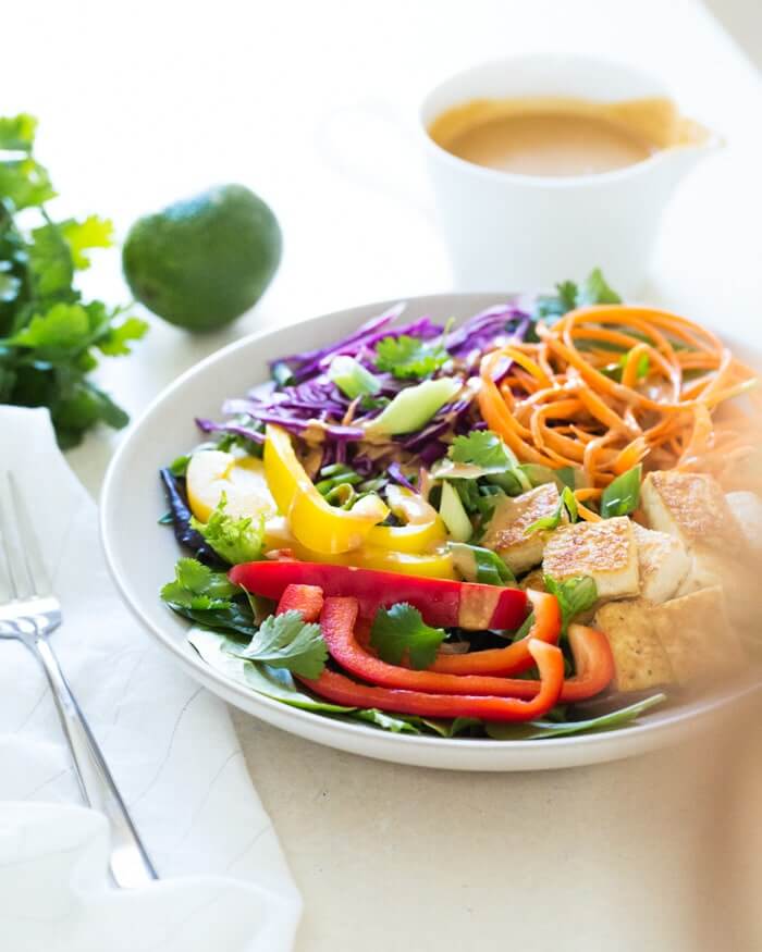 Thai Salad with Peanut Sauce Dressing |  A couple is cooking