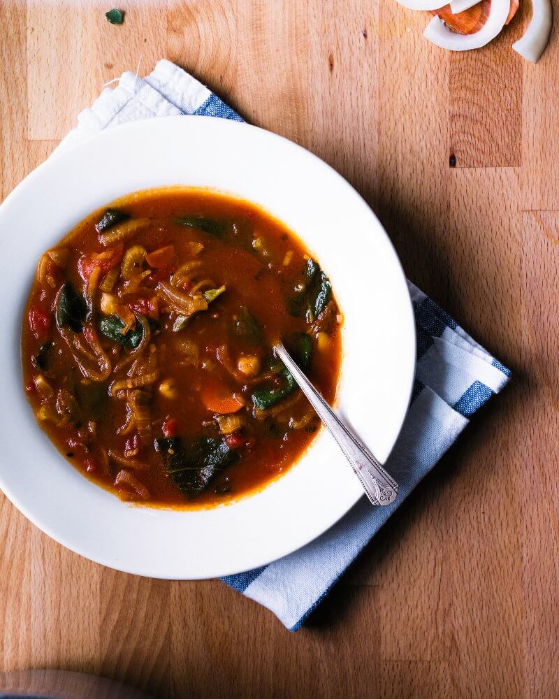 Chickpea Soup with Tomato and Sage |  A couple is cooking